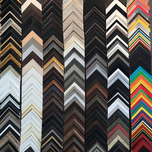 A variety of picture frame corners in different colors and materials, perfect for custom framing, arranged vertically in rows.