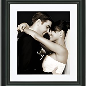 Framed photo of a couple in wedding attire, embracing and smiling at each other, makes a perfect Valentine’s gift.