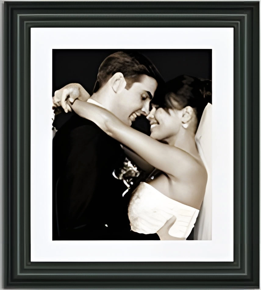 Framed photo of a couple in wedding attire, embracing and smiling at each other, makes a perfect Valentine’s gift.